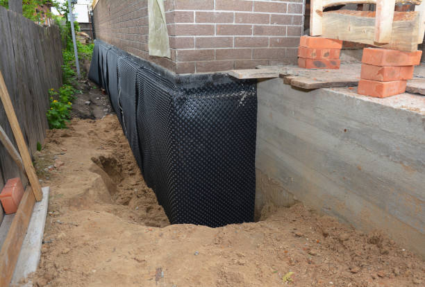 Happy homeowners after waterproofing job in Dunreith